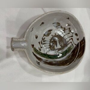 Vintage handmade stoneware pottery bowl with handle/spoonrest